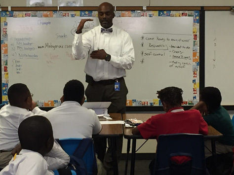 Roy Sessions, teacher at Haley Elementary, in front of student audience.