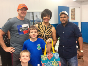 Nine-year old Fisher Gunderson (holding tote) was one of the first to complete his project.