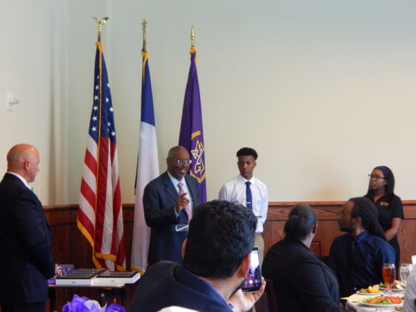 President addressing award recipients
