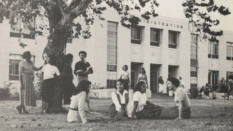 PVAMU students gathering in front of the old administration building in the 1900s
