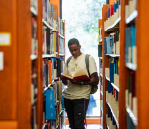 Student studying in the John B Coleman Library.