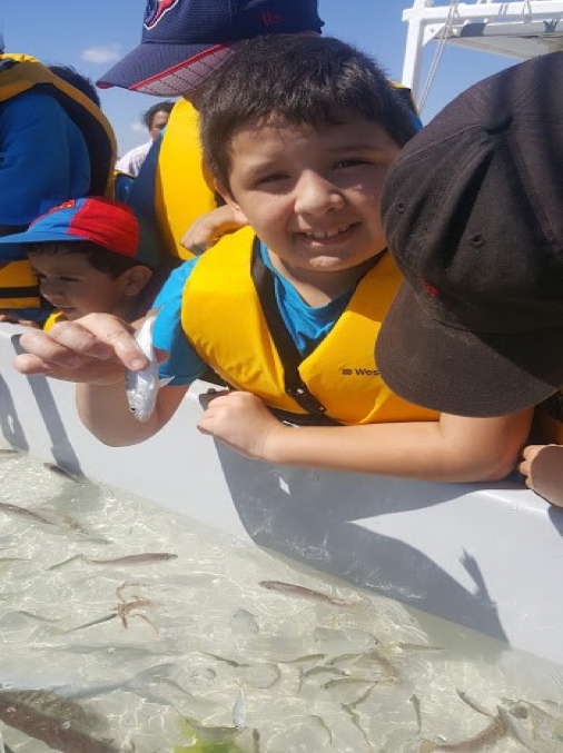 4-H Youth demonstrating species of fish to the group