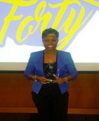 Andrea Mcdonald receiving her award