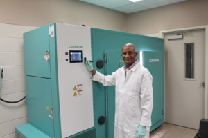 Tesfamichael Kebrom showing the plant growth chamber