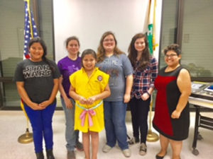 Second place winners (Belted sleeveless dress made from a long sleeve shirt) with 4-H Agent Castro (far right)
