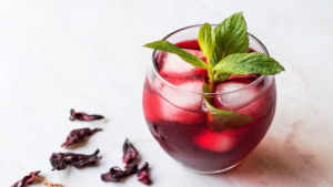 Cold Brew Hibiscus Tea With Ice And Mint Leaves.