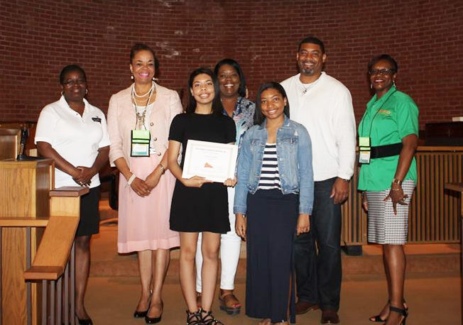 Amari Callies displays her award