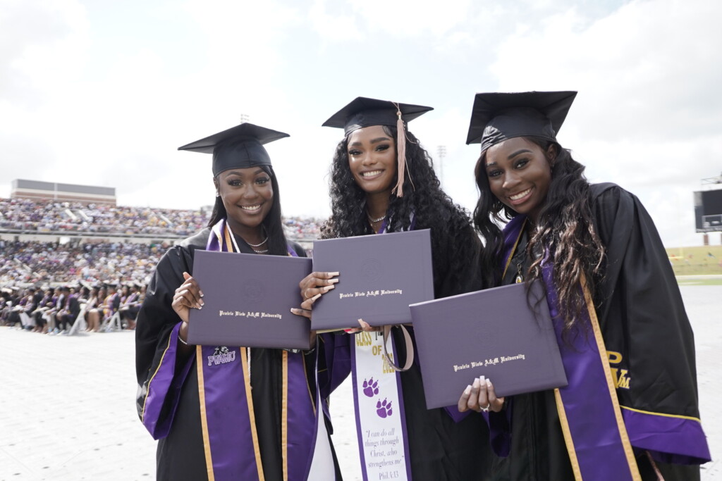 three female graduate students at PVAMU commencemnt