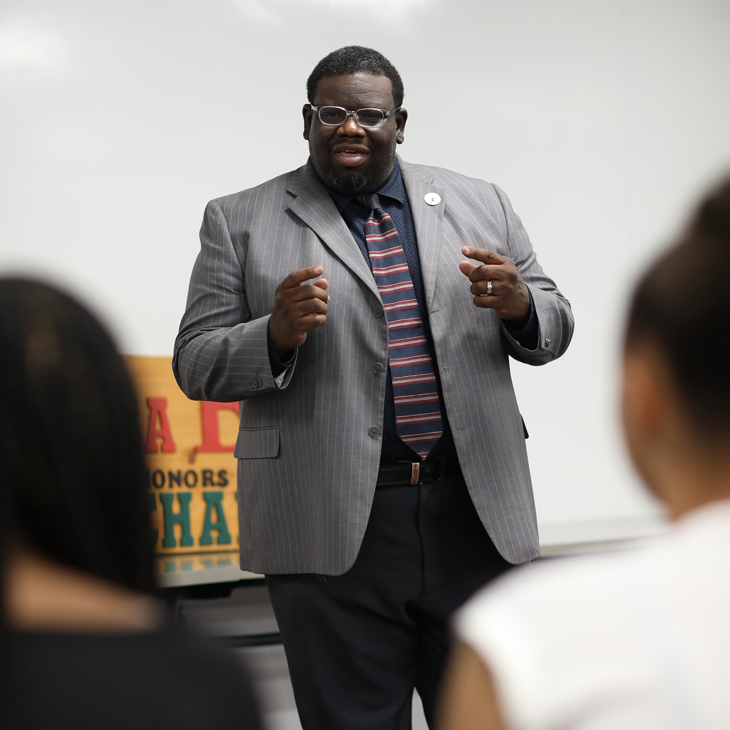 Dr. Quincy Moore teaching in a classroom