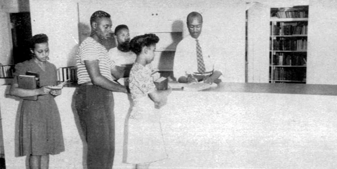 Students checking out books at the Circulation Desk