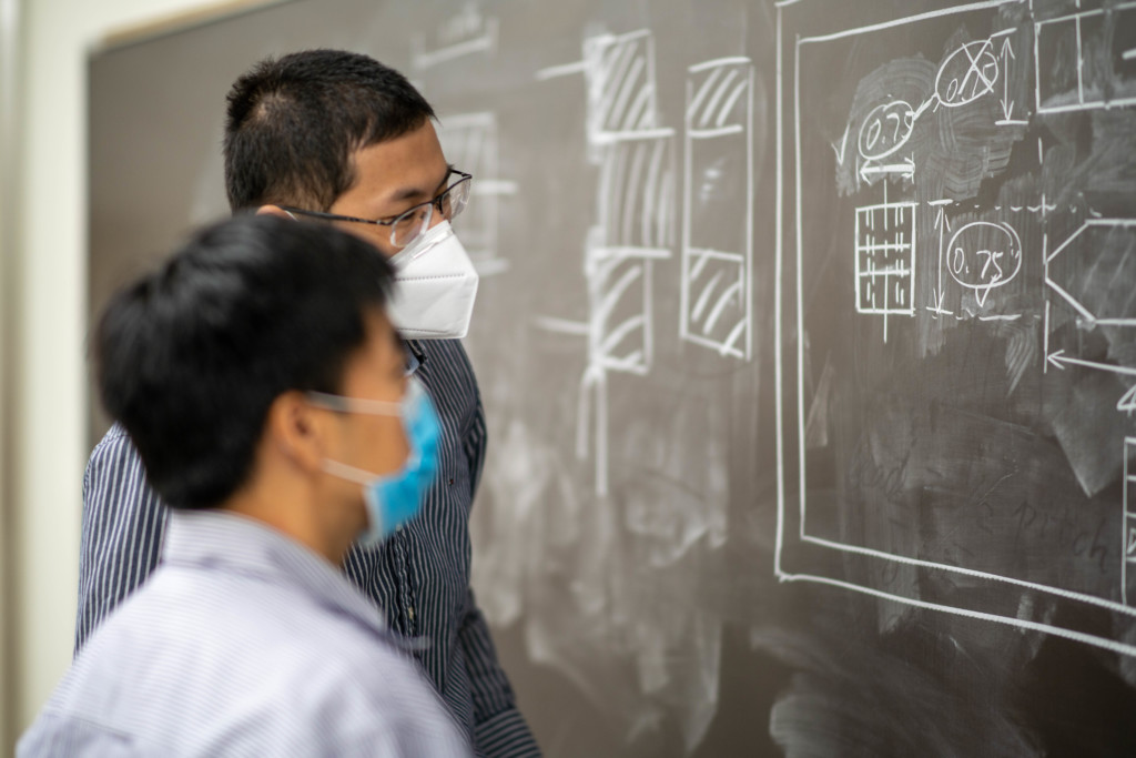 Xiaobo Peng, Ph.D. (left) and Lai Jiang, Ph.D. in a mechanical engineering classroom