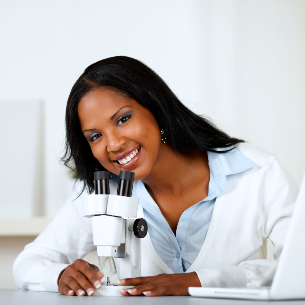 Woman Looking Into Microscope