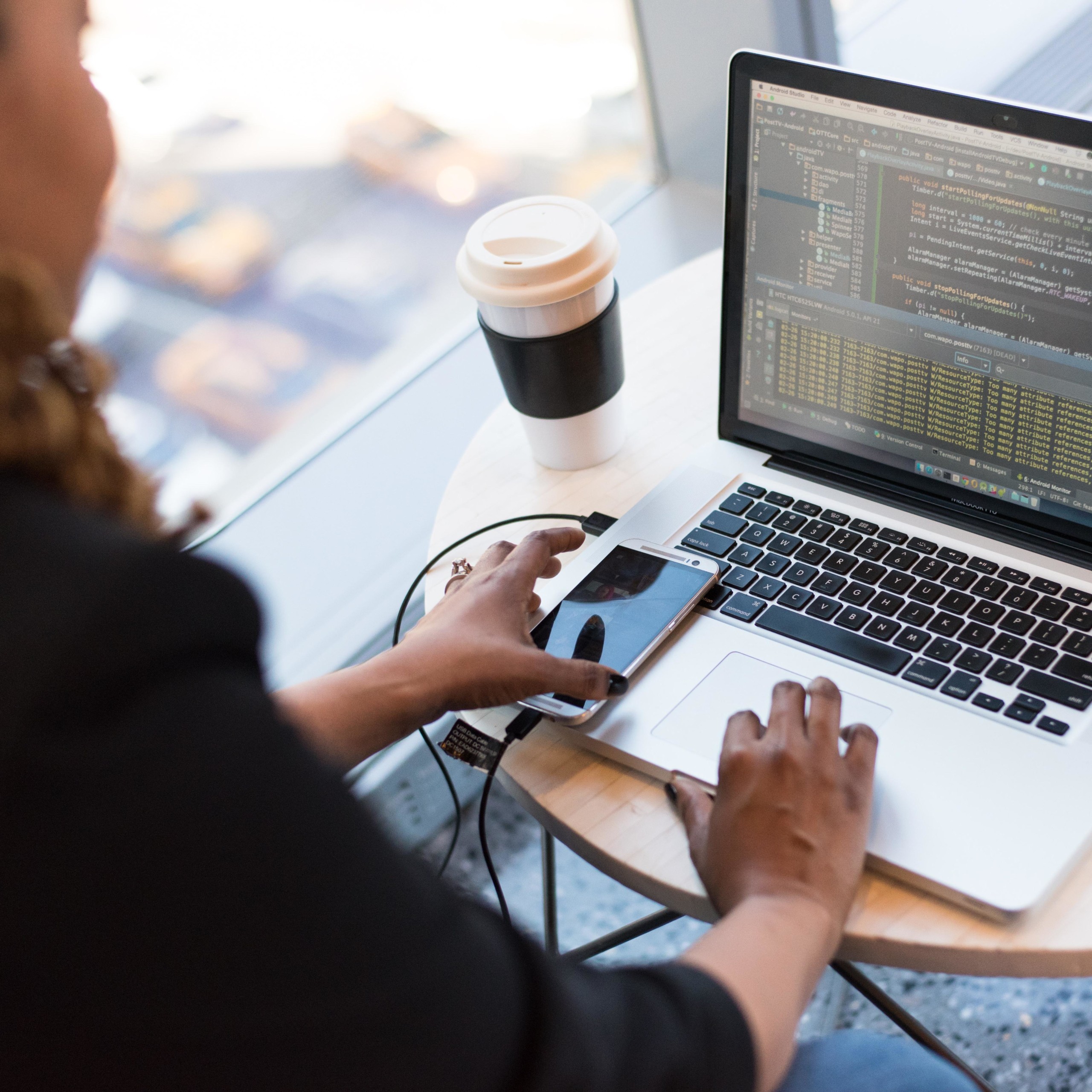 Woman On Computer with phone