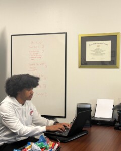 Trenton Jeffers working on research via laptop
