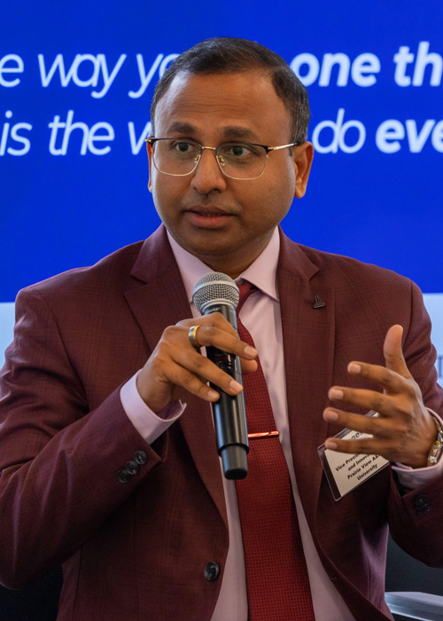 Magesh Rajan speaking at a seminar
