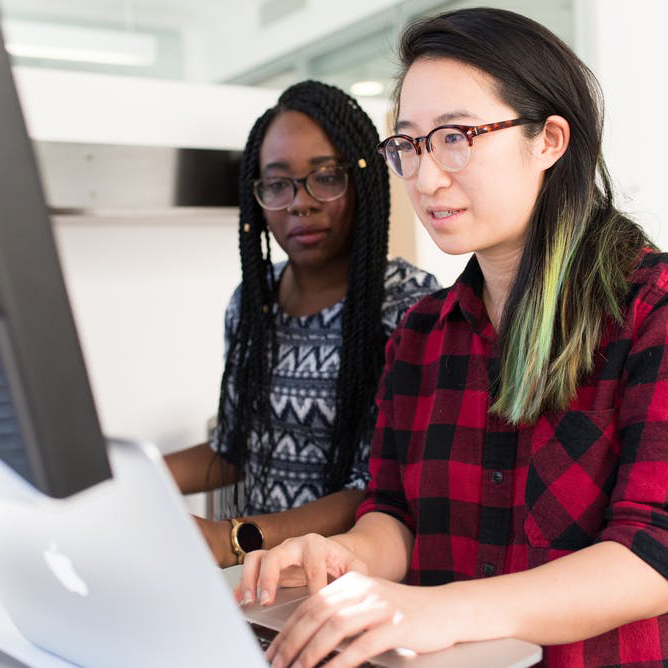 Two Women At Computer