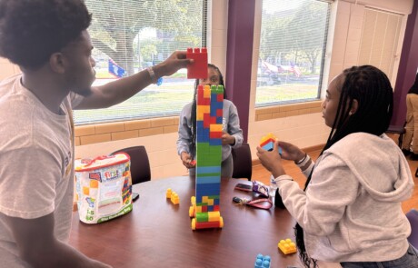 TLS students participating in a Lego building challenge