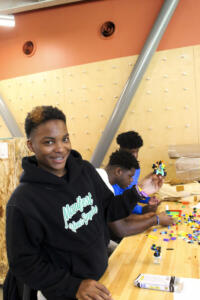 ARTEC Student displaying a LEGO car.