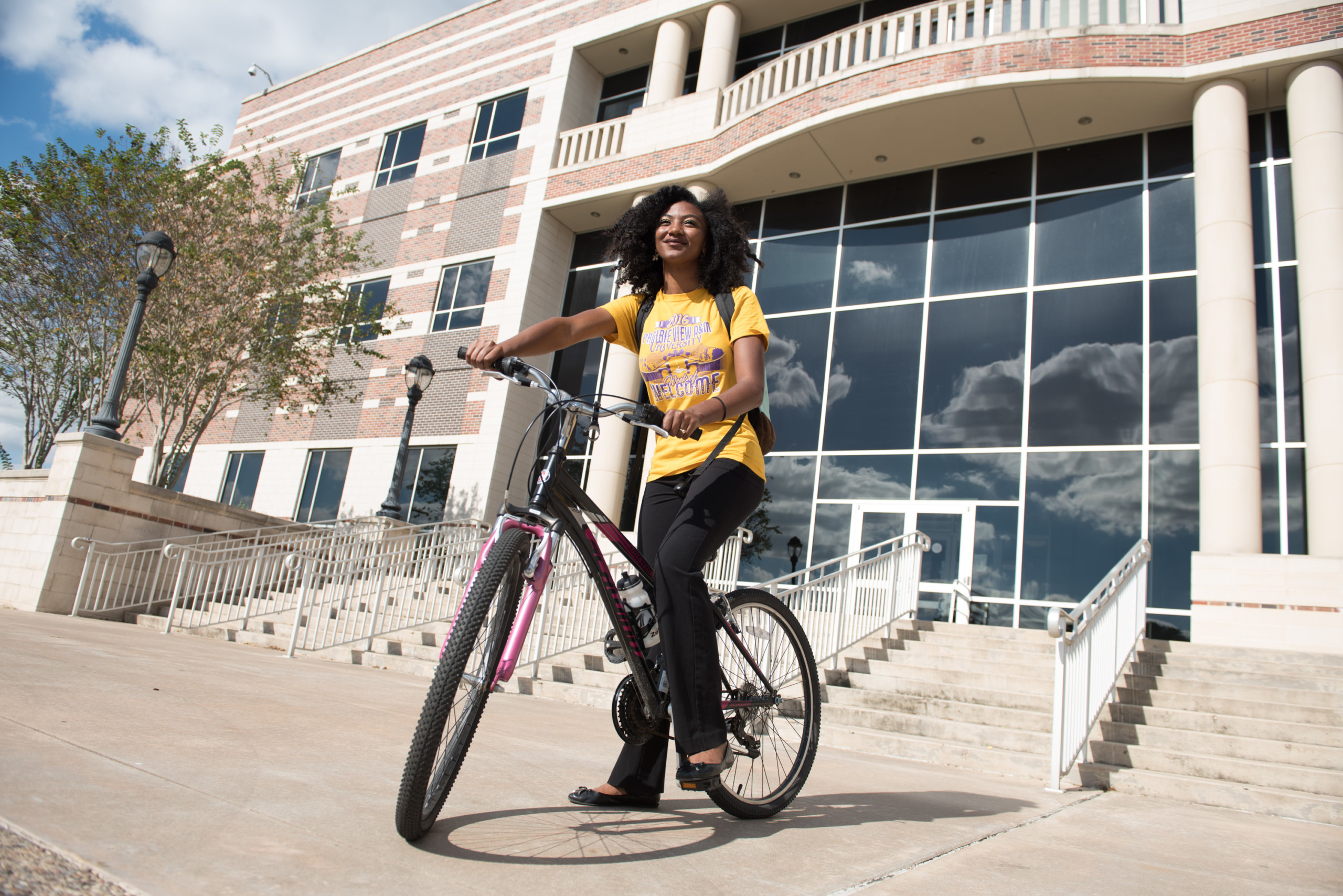 Student Riding Bike outside the MSC