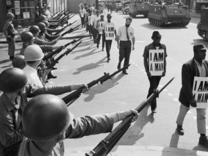 National Guard troops lined Beale Street during a protest on March 29 , 1968. “I was in every march, all of ’em, with that sign: I AM A MAN,” recalls former sanitation worker Ozell Ueal. (Bettmman Collection / Getty Images)