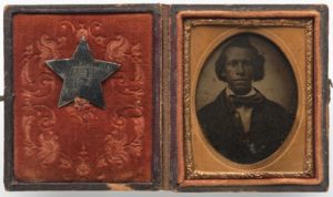 Tintype of Creed Miller with star-shaped military identification pin