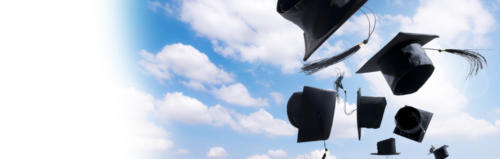 graduation hats flying