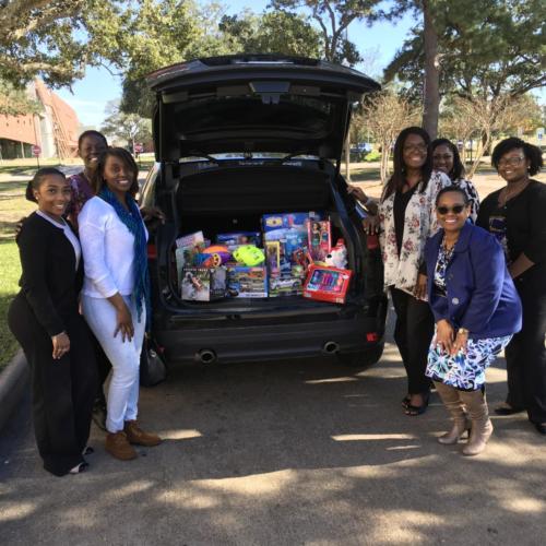 toys in a trunk with women