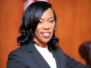 Judge Erica Hughes standing at judge bench