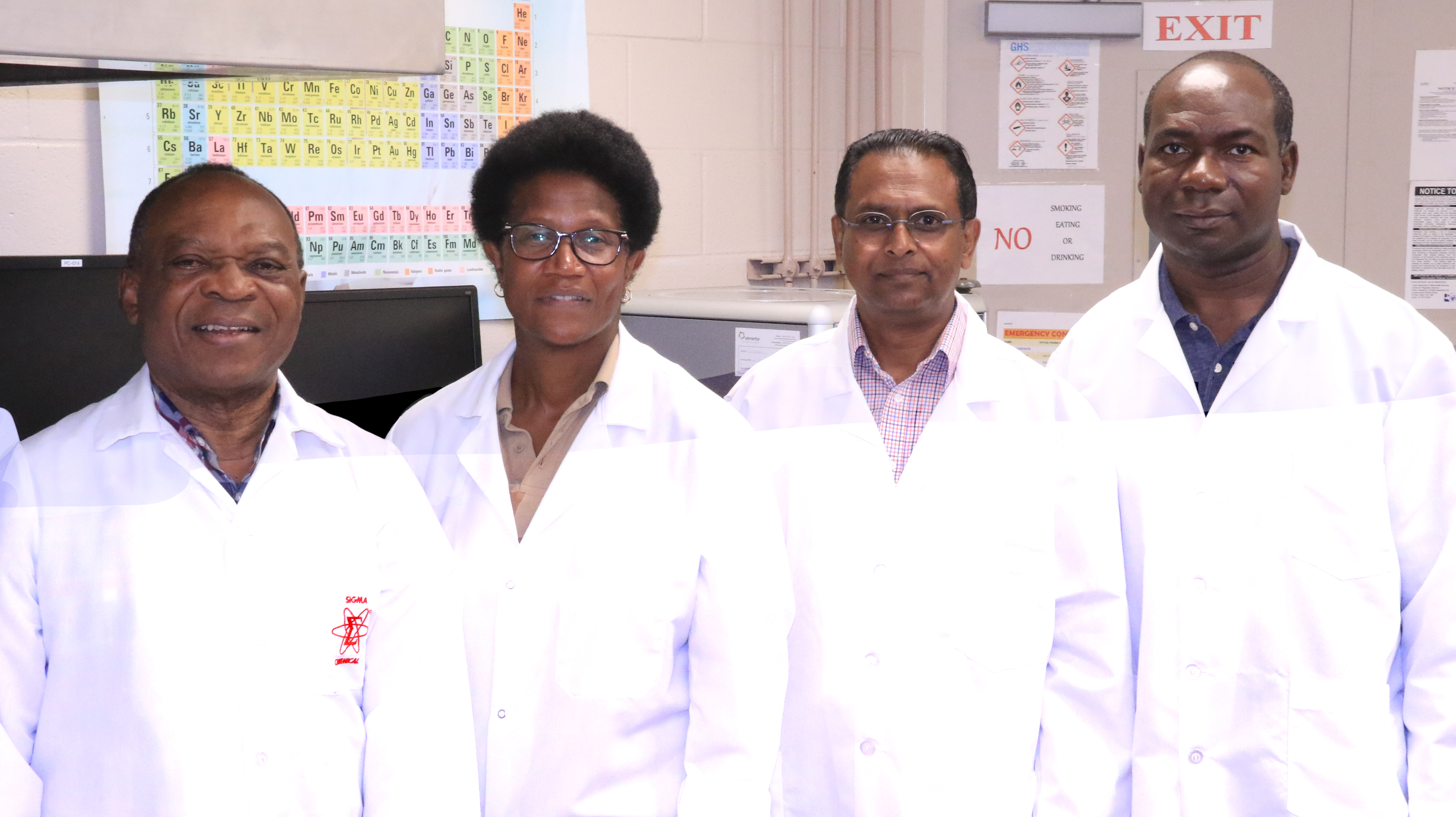 4 researchers in white coats