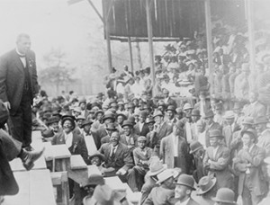 Photo shows Booker T. Washington on a stage.