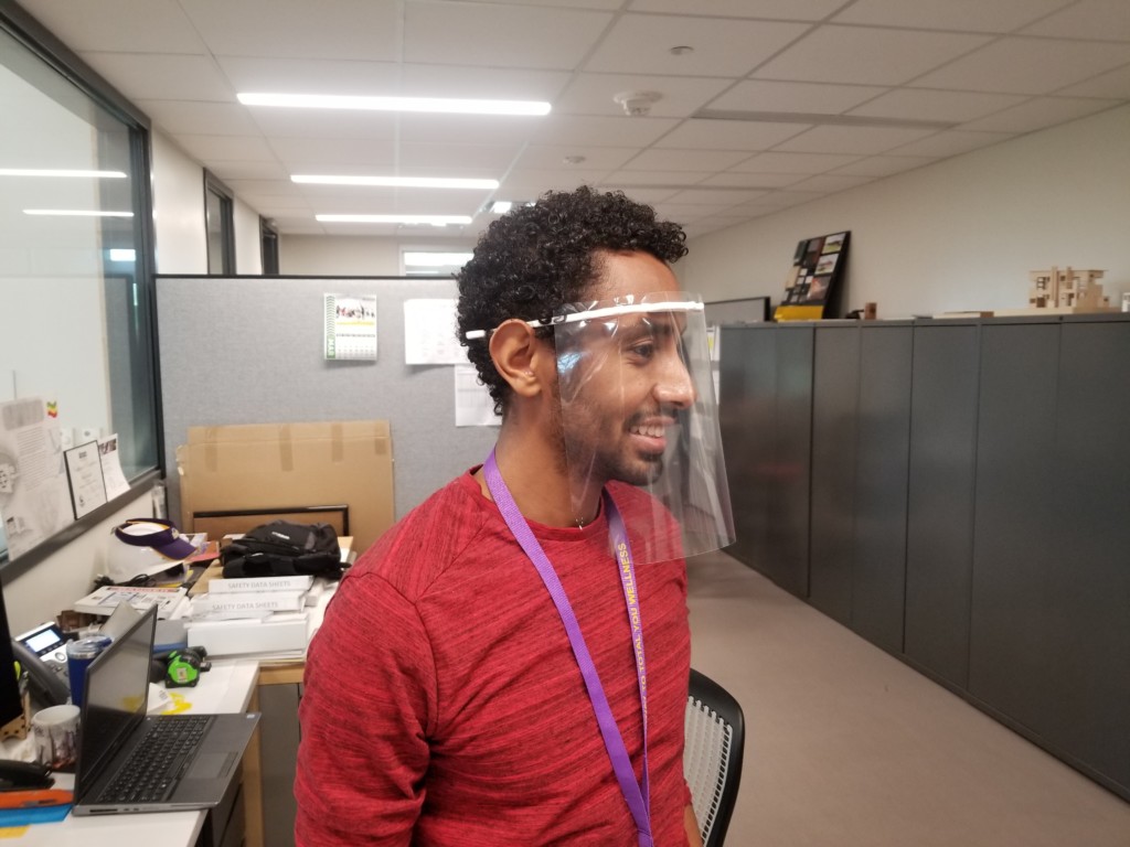 Abel Simie, manager of the PVAMU Fabrication Center in the School of Architecture, models a face shield created using 3D printing. 