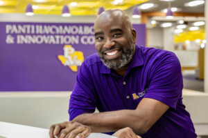 Carlos Wallace poses for a professional headshot 