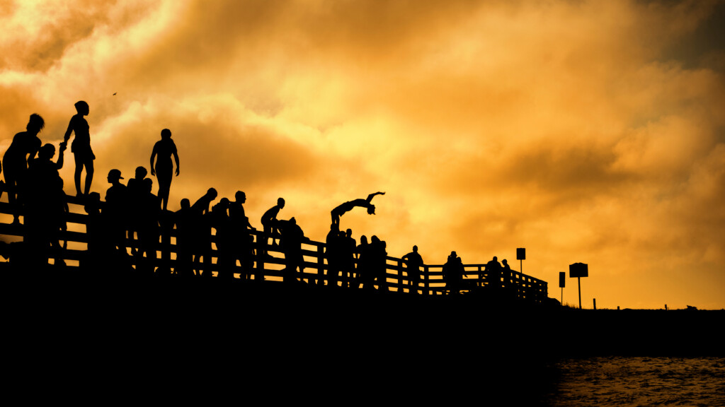 Beach rd martha's vineyard Edgartown and Oak Bluffs sunset summer sky with jumping people silhouettes