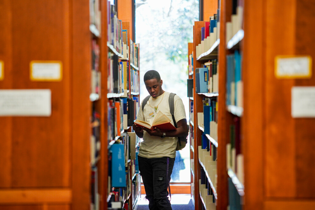 PVAMU student reading a book