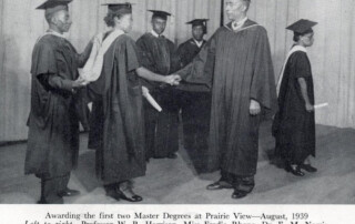 Principal W. R. Banks awarding the first two master’s degrees at Prairie View A&M in August of 1939