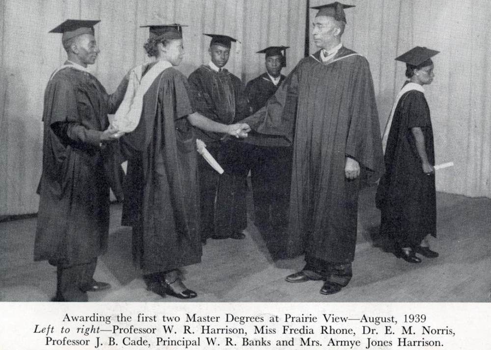 Principal W. R. Banks awarding the first two masterās degrees at Prairie View A&M in August of 1939